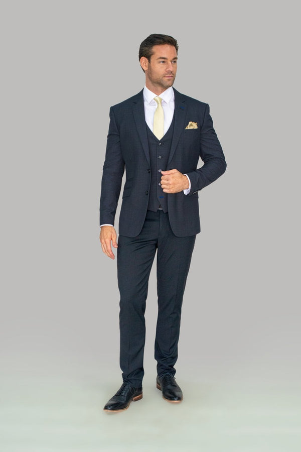 Every gentleman needs a navy suit and this perfectly soft three piece, which combines elegance and comfort, styled perfectly for a wedding. With its luxury buttons and a beautiful inner lining you can’t go wrong with House of Cavani. Features 80% Polyester, 20% Rayon 2 buttons and 2 internal pockets Slim fitting Model Measurements Our Model is in a size 42 chest with 32 trousers standing at a height of 6 foot - Party Wear | Office Wear
