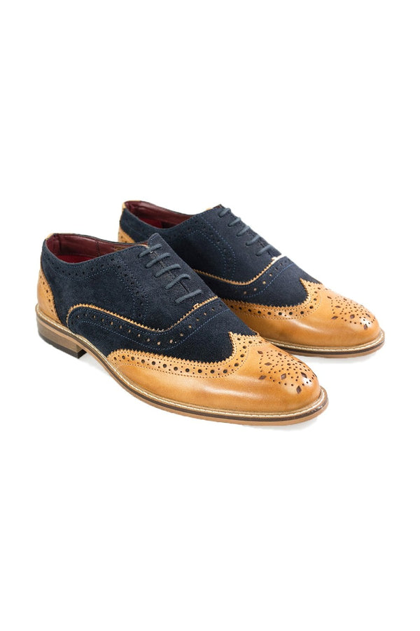 They say you can tell a lot from a gentleman's shoes. Take Duke Navy Tan for example. This Wingtip Combi Brogue shoe combines a tan hardwearing upper with a dark navy suede vamp it features a lace up front with a man made sole to complete your best weekend finery. Finished with a low heel its safe to assume these shoes can add the finishing touch to any formal attire.