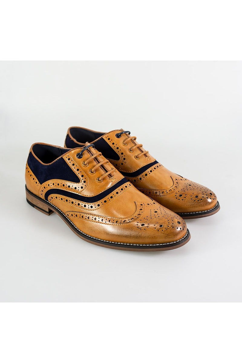 They say you can tell a lot from a gentleman's shoes, so why not make an impression with the Ethan black, brogue style.  