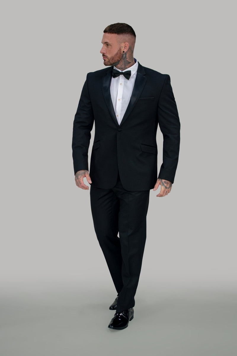Elegant, graceful and classic, this tuxedo is the signature look. Build your confidence in this suit made for that special occasion. Look distinguished and fashionable in this tuxedo. Feel the Bond moment.   Stylist Advice Pair this with our Classic white Shirt and black bow  (also available in Velvet) tie to complete this look. Features 72% polyester, 23% Rayon & 5% Elasthan 2 buttons and 2 internal pockets Slim fitting