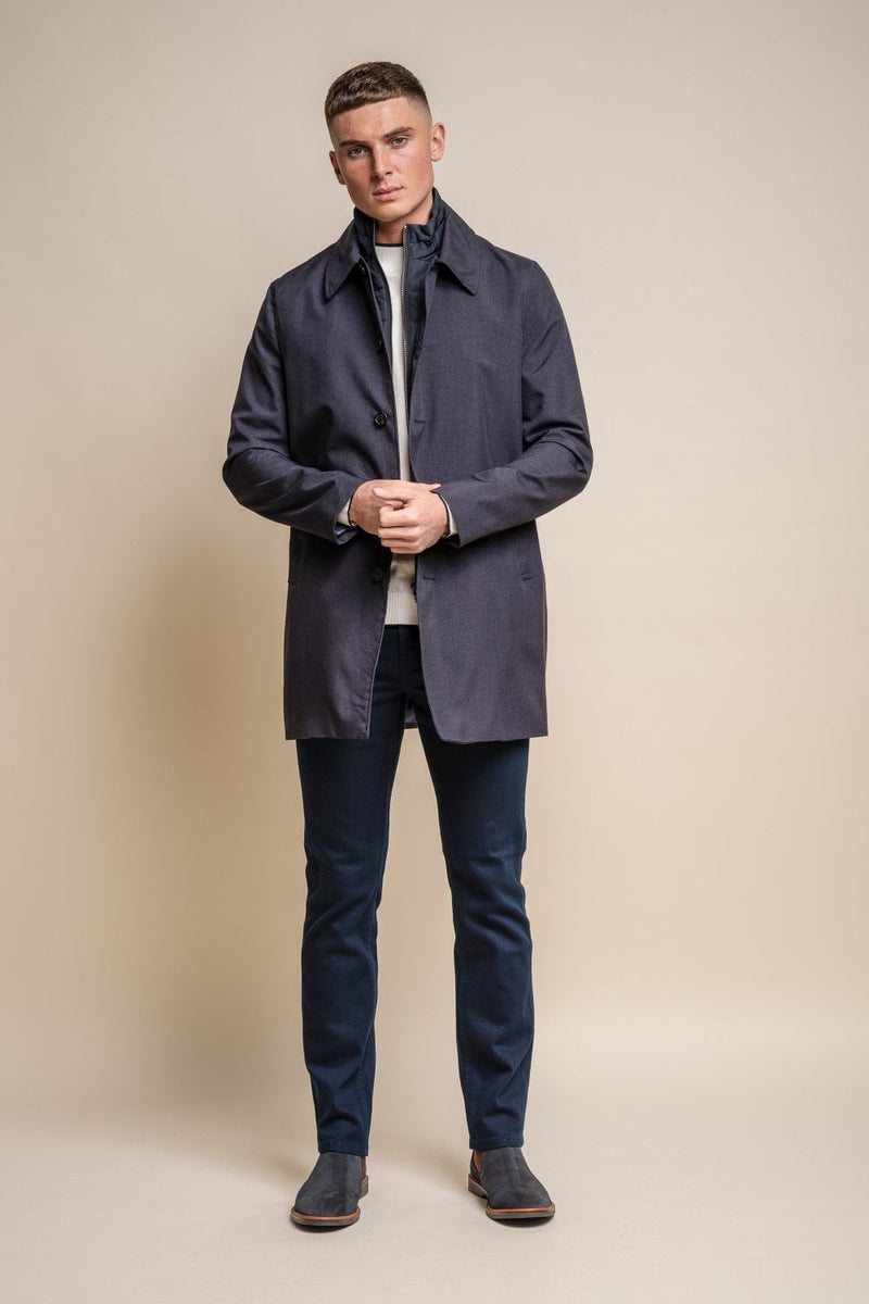 Add an essential piece to your winter wardrobe this season with our stylish navy Brando Mac coat with a detachable padded insert. Its dark colours and slimming fit will not only keep you warm this winter it will also keep you looking stylish. Stylist tips Layer up your look with a long-sleeved pullover and white shirt Features 100% polyester 5 buttons and 1 internal pocket 2 outer pockets Detachable padded insert Comes in Slate Grey