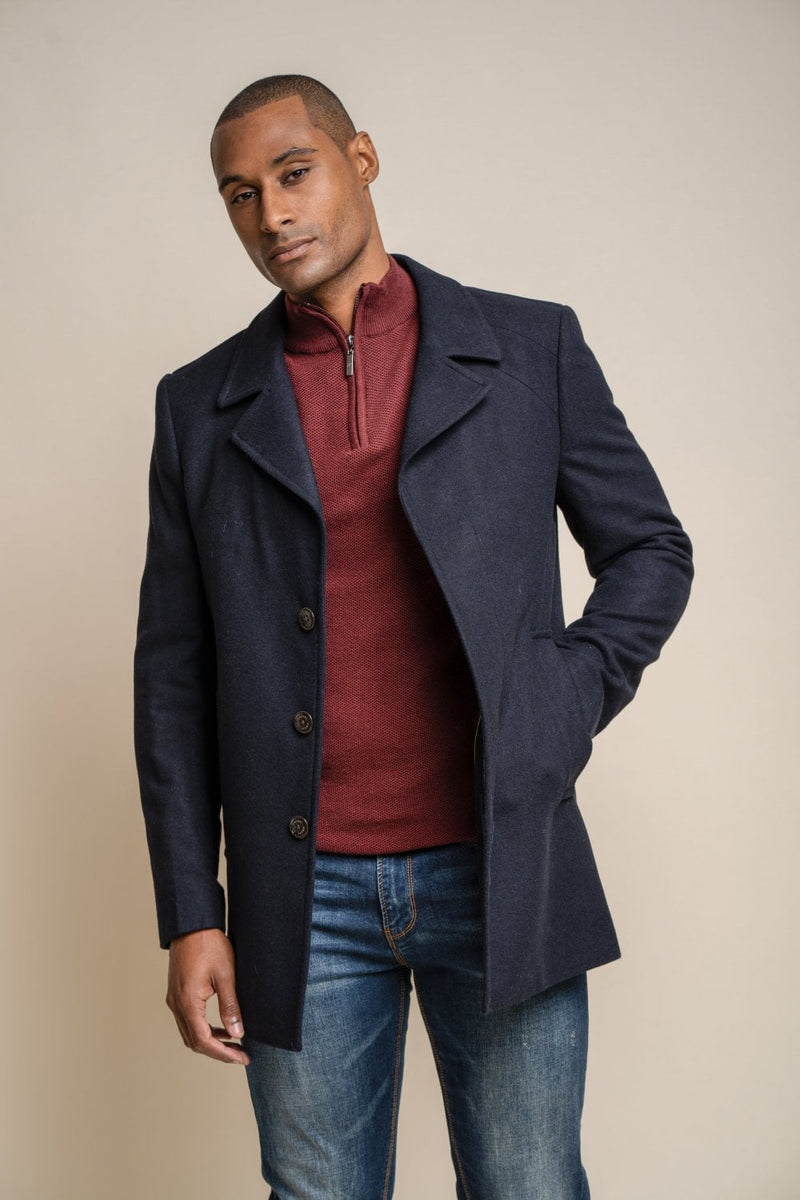 Add an essential piece to your winter wardrobe this season with our stylish navy Brando Mac coat with detachable padded insert. Its dark colours and slimming fit will not only keep you warm this winter it will also keep you looking stylish.