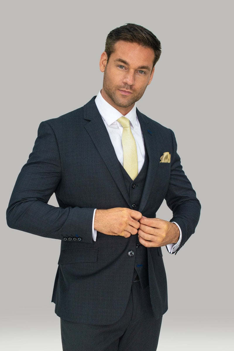 Every gentleman needs a navy suit and this perfectly soft three piece, which combines elegance and comfort, styled perfectly for a wedding. With its luxury buttons and a beautiful inner lining you can’t go wrong with House of Cavani. Features 80% Polyester, 20% Rayon 2 buttons and 2 internal pockets Slim fitting Model Measurements Our Model is in a size 42 chest with 32 trousers standing at a height of 6 foot - Party Wear | Office Wear